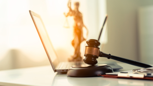 Online law and justice concept on table in modern office